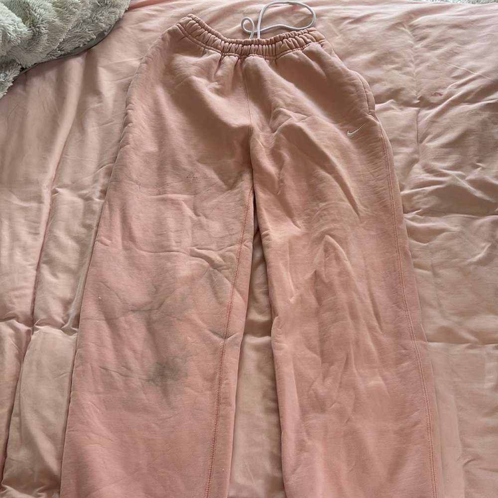 Pink nike sweatpants size extra small. They do have stains.